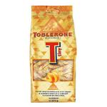 name} Шоколади Toblerone Млечен швейцарски шоколад с мед, бадеми и захаросана портокалова кора с джинджифил.34 бр. 272 гр.