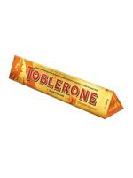Toblerone Швейцарски шоколад с мед и бадемова нуга, комбиниран с добавка на портокалови кори, покрити с джинджифил 360 гр